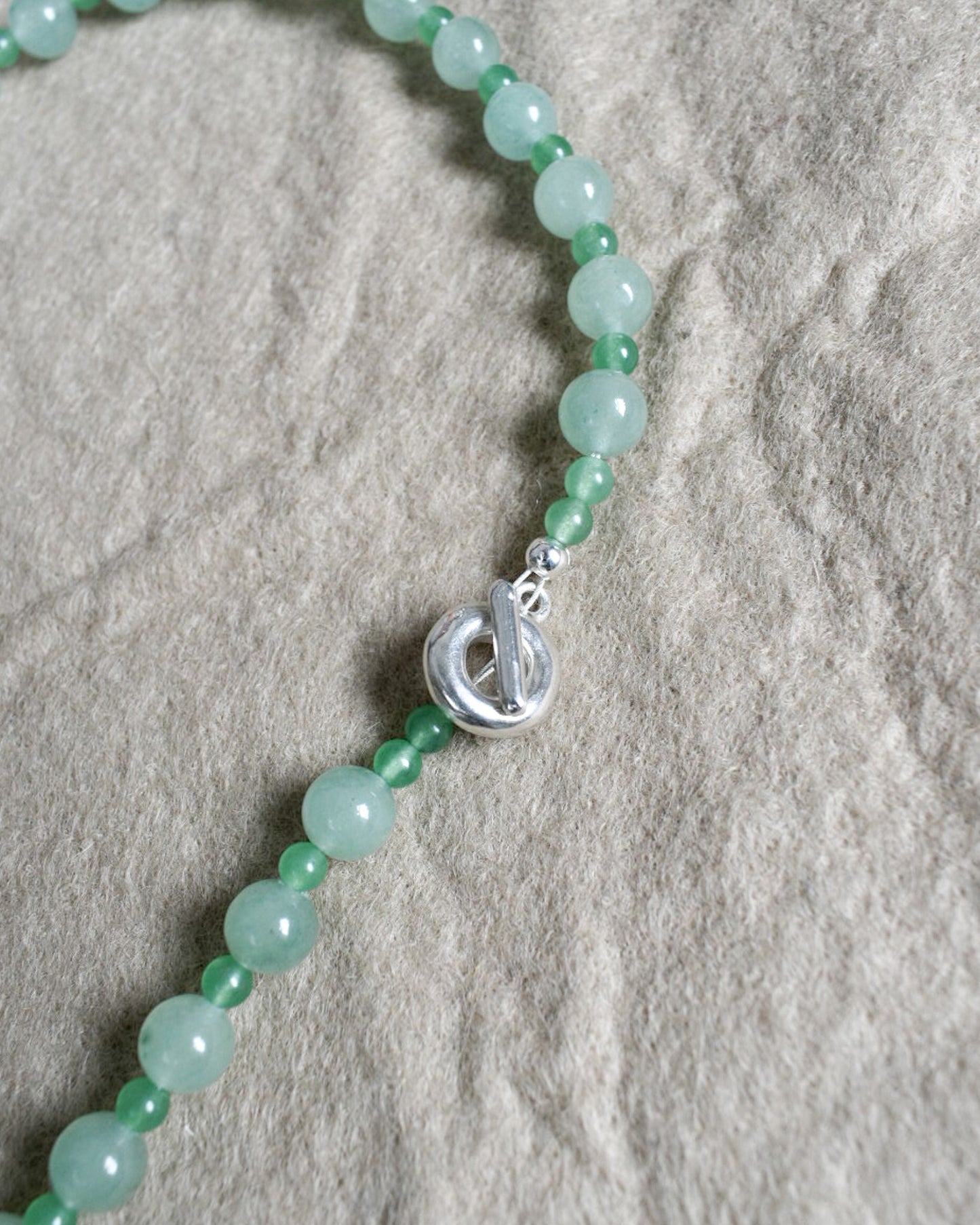 mojito green round semi precious stone bead necklace. large and small round aventurine beads. finished with solid recycled silver toggle clasp in doughnut shape.
