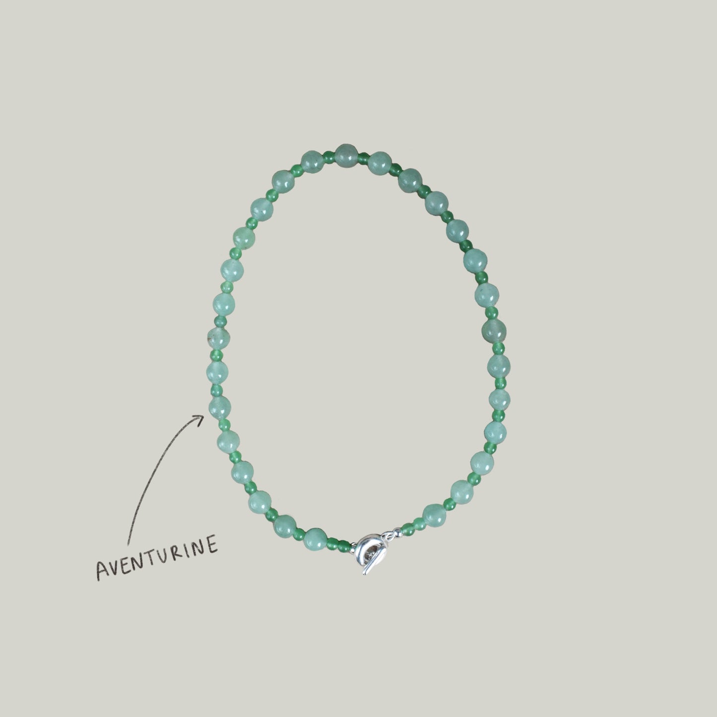 mojito green round semi precious stone bead necklace. large and small round aventurine beads. finished with solid recycled silver toggle clasp in doughnut shape.