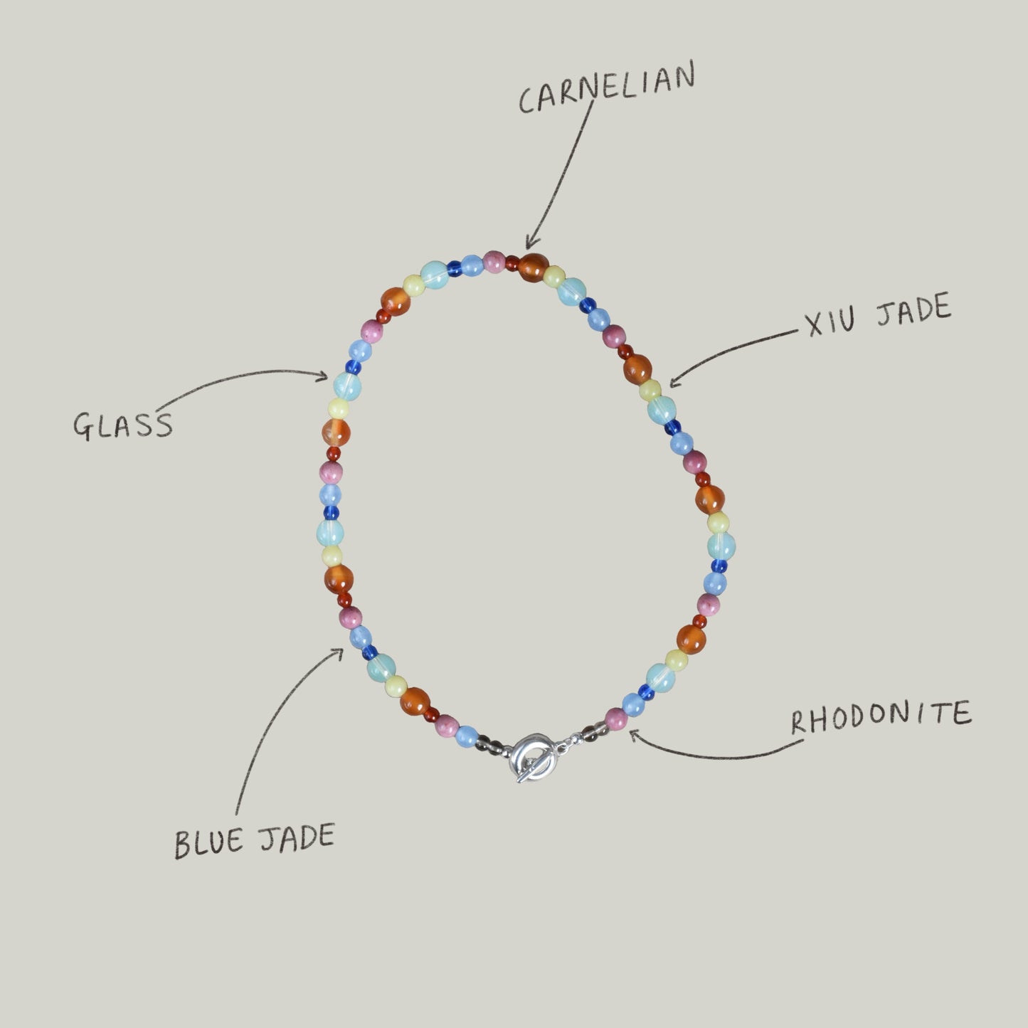 colour party beaded bracelet, bright rainbow stone and glass beads. blue jade, agate, carnelian, rhodonite. finished with solid recycled silver doughnut toggle clasp.