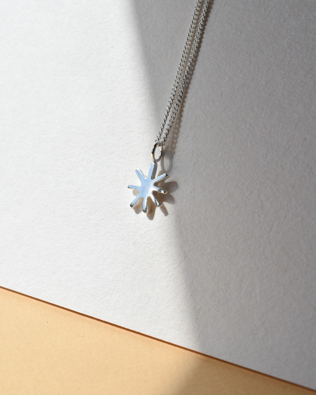 mini sunbeam sunshine shaped solid silver pendant necklace on chain. handmade solid recycled silver