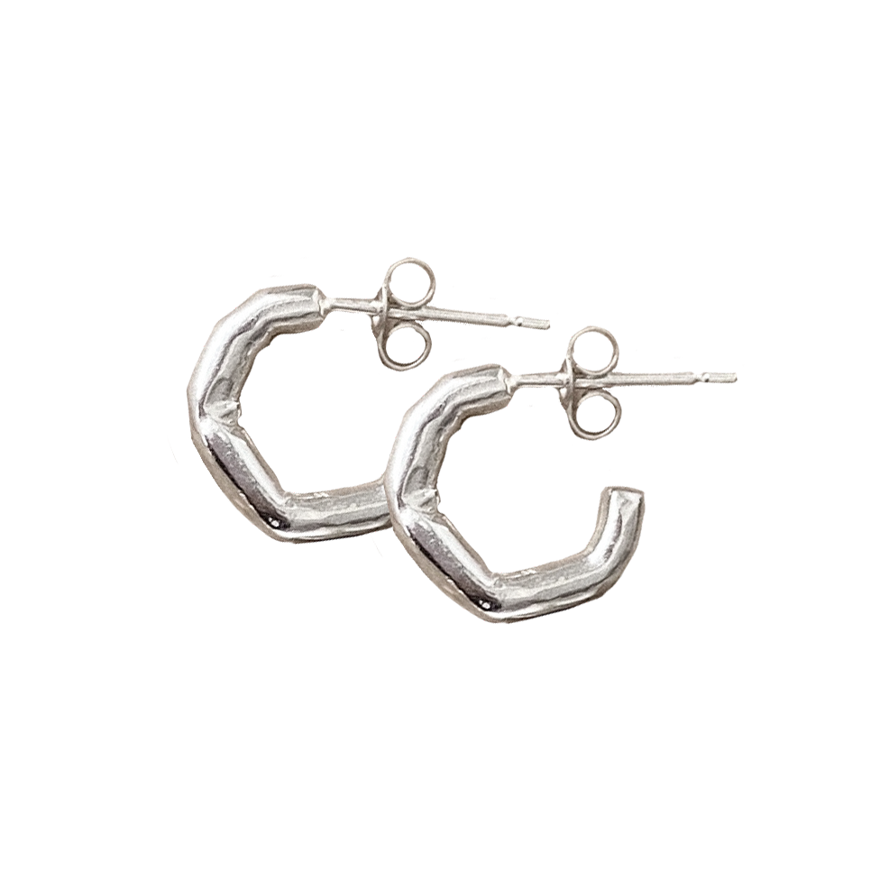 mini delicate thin hoops with organic texture and creases and shapes. handmade in solid recycled silver with push on backs. minimal small hoop earrings.