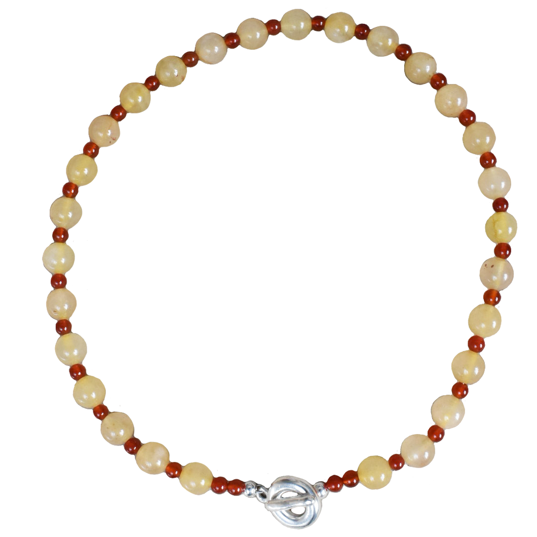 peach melba round smooth colourful beaded necklace with red carnelian and yellow jade. finished with solid silver doughnut shaped clasp.