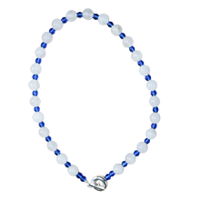 Load image into Gallery viewer, white and blue beaded necklace. large round white jade and small royal blue glass.  finsihed with solid recycled silver toggle clasp handmade doughnut shape. playful and fun.
