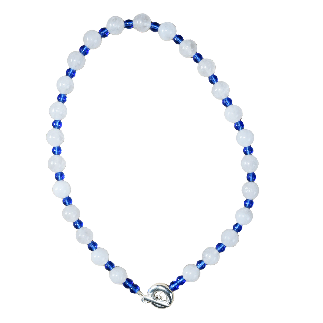 white and blue beaded necklace. large round white jade and small royal blue glass.  finsihed with solid recycled silver toggle clasp handmade doughnut shape. playful and fun.