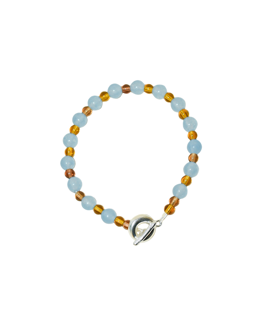 colourful beaded necklace in brown glass beads and baby blue jade semi precious stones. finished with hand carved solid recycled silver doughnut clasps.