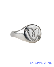 Load image into Gallery viewer, hand carved and personalised solid recycled silver signet ring. etched into with doodle of a heart and arrow and initial. 
