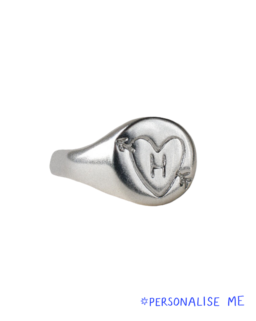 hand carved and personalised solid recycled silver signet ring. etched into with doodle of a heart and arrow and initial. 