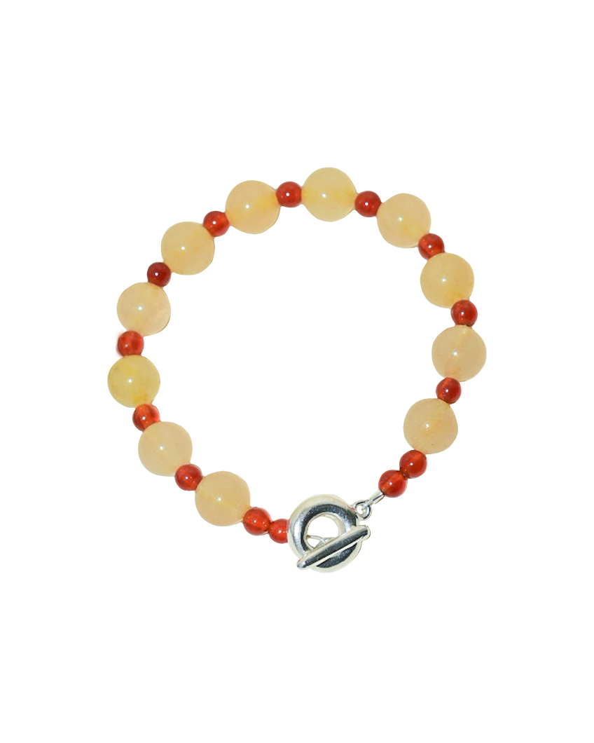 peach melba round smooth colourful beaded braclelet with red carnelian and yellow jade. finished with solid silver doughnut shaped clasp.