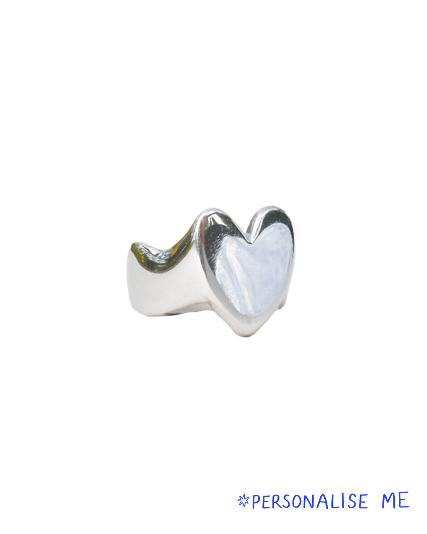 hand carved heart shaped signet ring with waved band and organic wobbly shape. shiny solid recycled silver. eco metal.