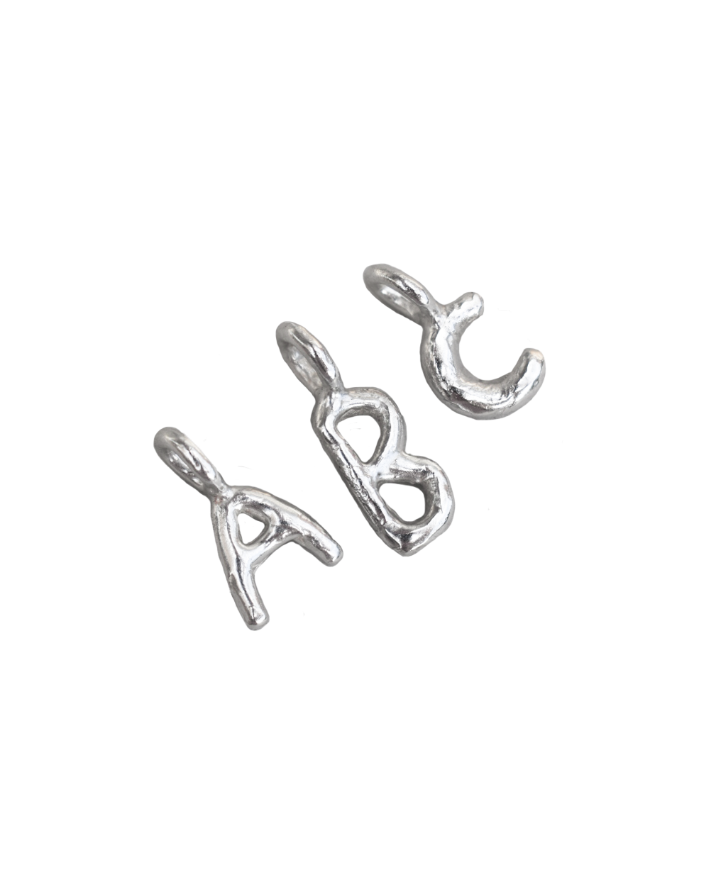 recycled silver hand moulded wobbly alphabet initial charms with organic texture 