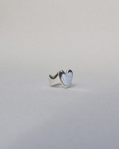 hand carved heart shaped signet ring with waved band and organic wobbly shape. shiny solid recycled silver. eco metal.