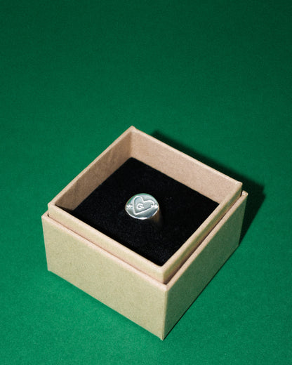 hand carved and personalised solid recycled silver signet ring. etched into with doodle of a heart and arrow and initial. 