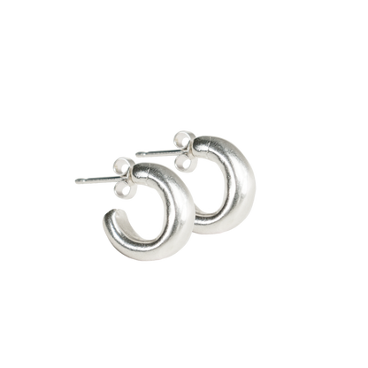 small simple smooth round minimal huggy hoop earrings. solid eco recycled silver with push backs.